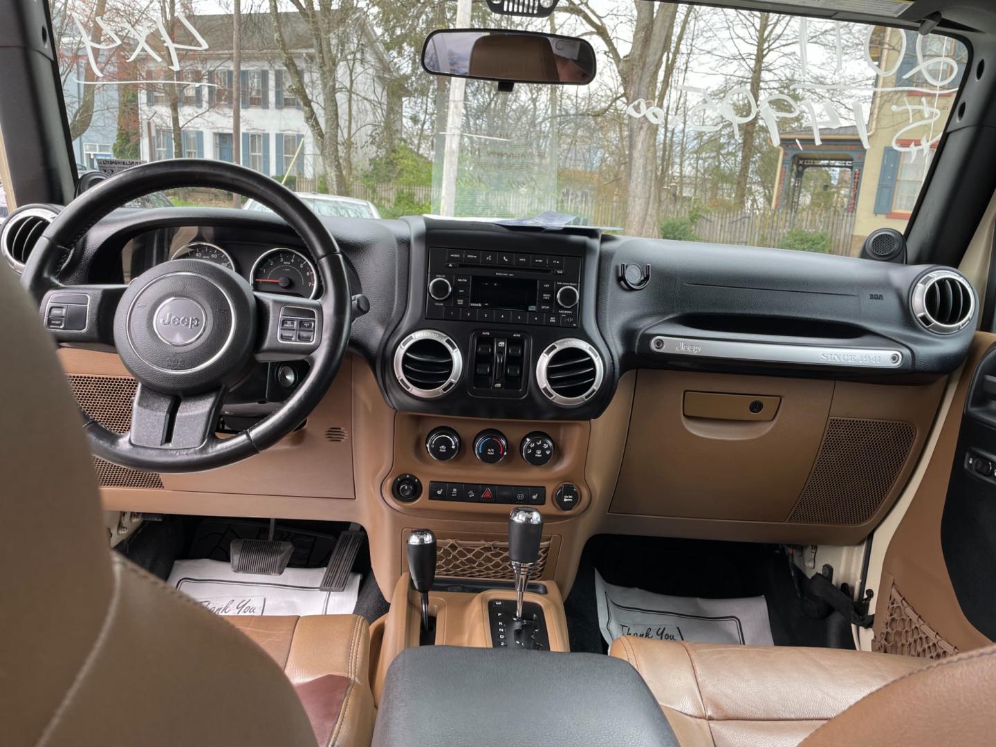 2011 Jeep Wrangler Unlimited Sahara 4WD (1J4BA5H11BL) with an 3.8L V6 OHV 12V engine, located at 101 N. Main Street, Muncy, PA, 17756, (570) 546-5462, 41.207691, -76.785942 - Photo#4